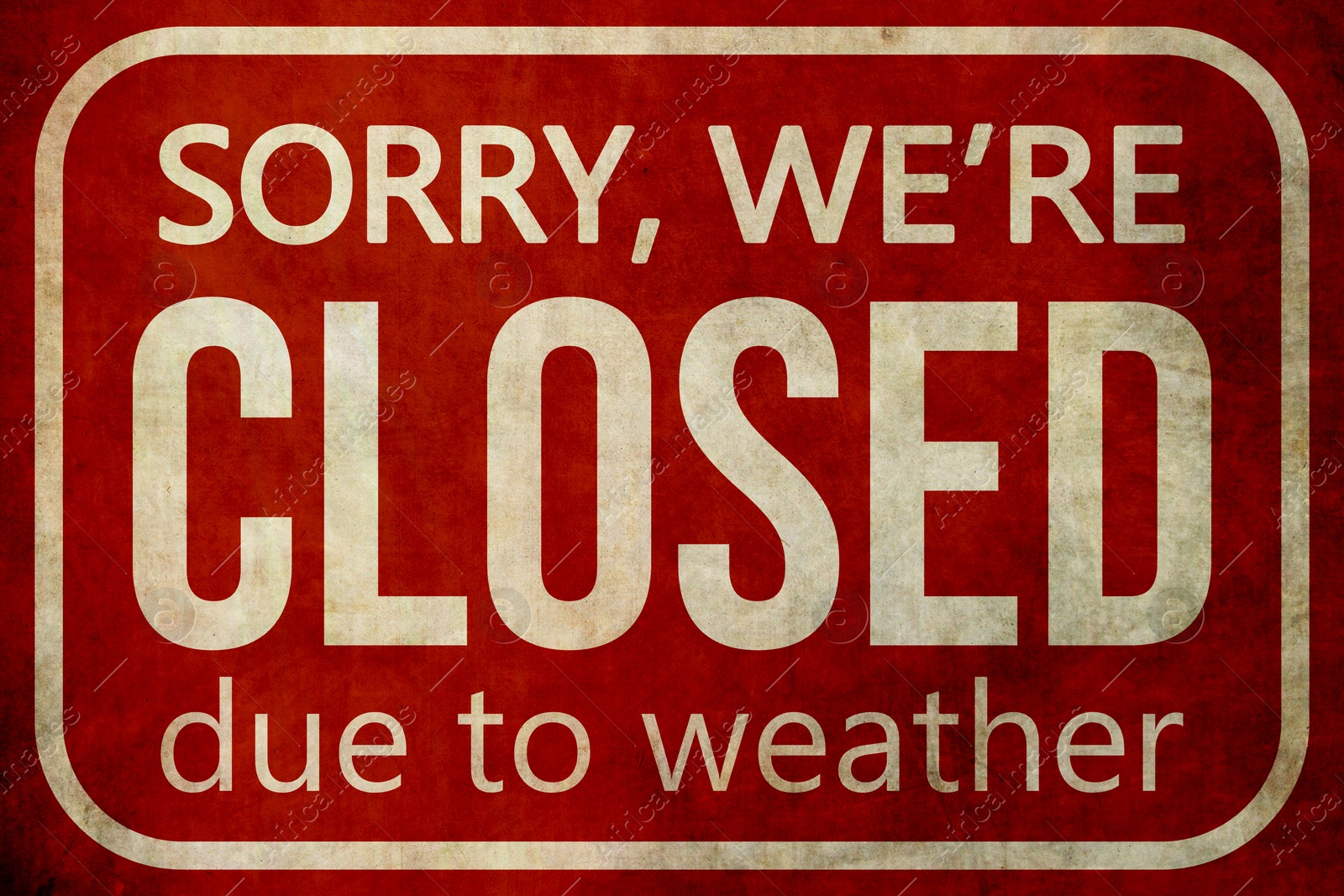 Image of Sorry we are closed due to weather sign. Text and snowflakes on red background