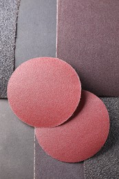 Many sheets of sandpaper as background, top view