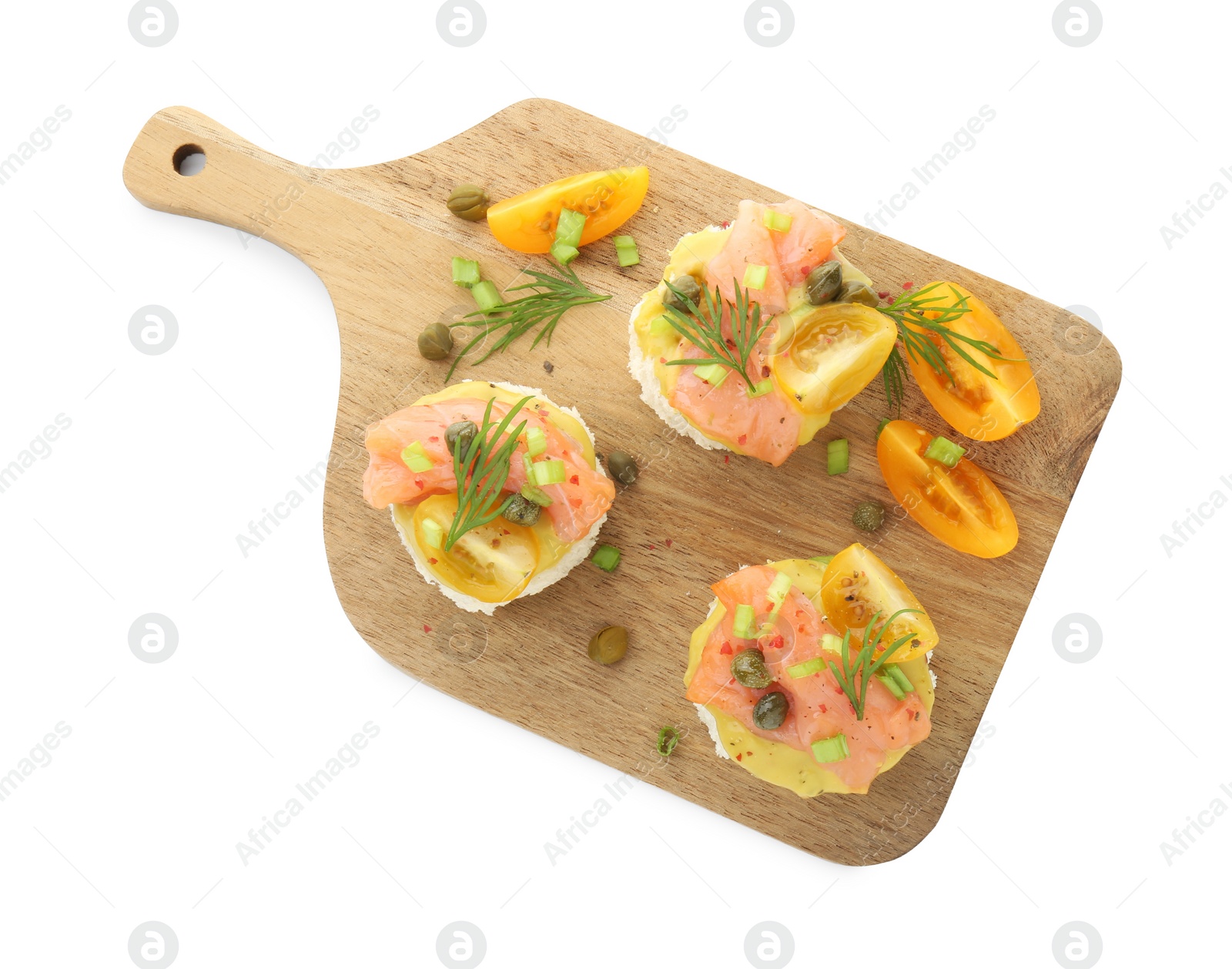 Photo of Tasty canapes with salmon, tomatoes, capers and herbs isolated on white, top view