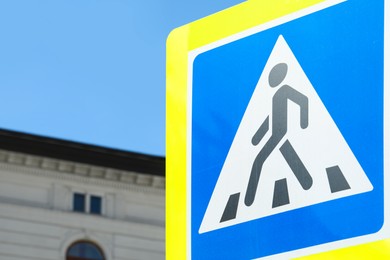 Pedestrian Crossing traffic sign in city on sunny day, closeup