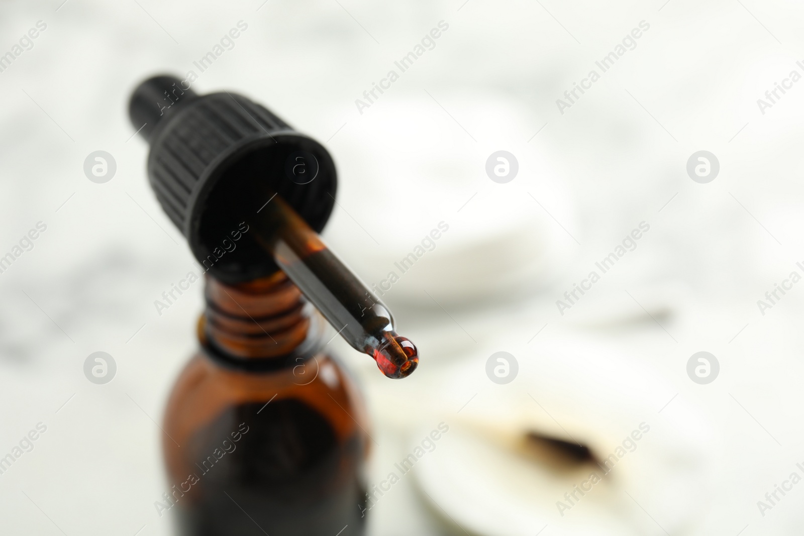 Photo of Bottle of medical iodine and dropper, closeup. Space for text