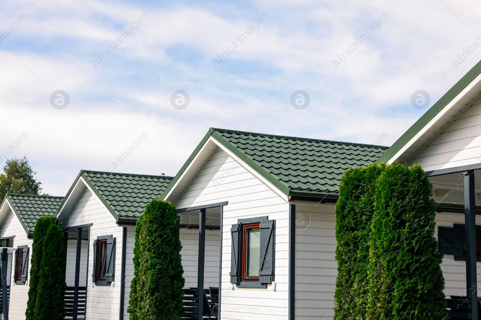 Photo of Exterior of beautiful modern white houses outdoors