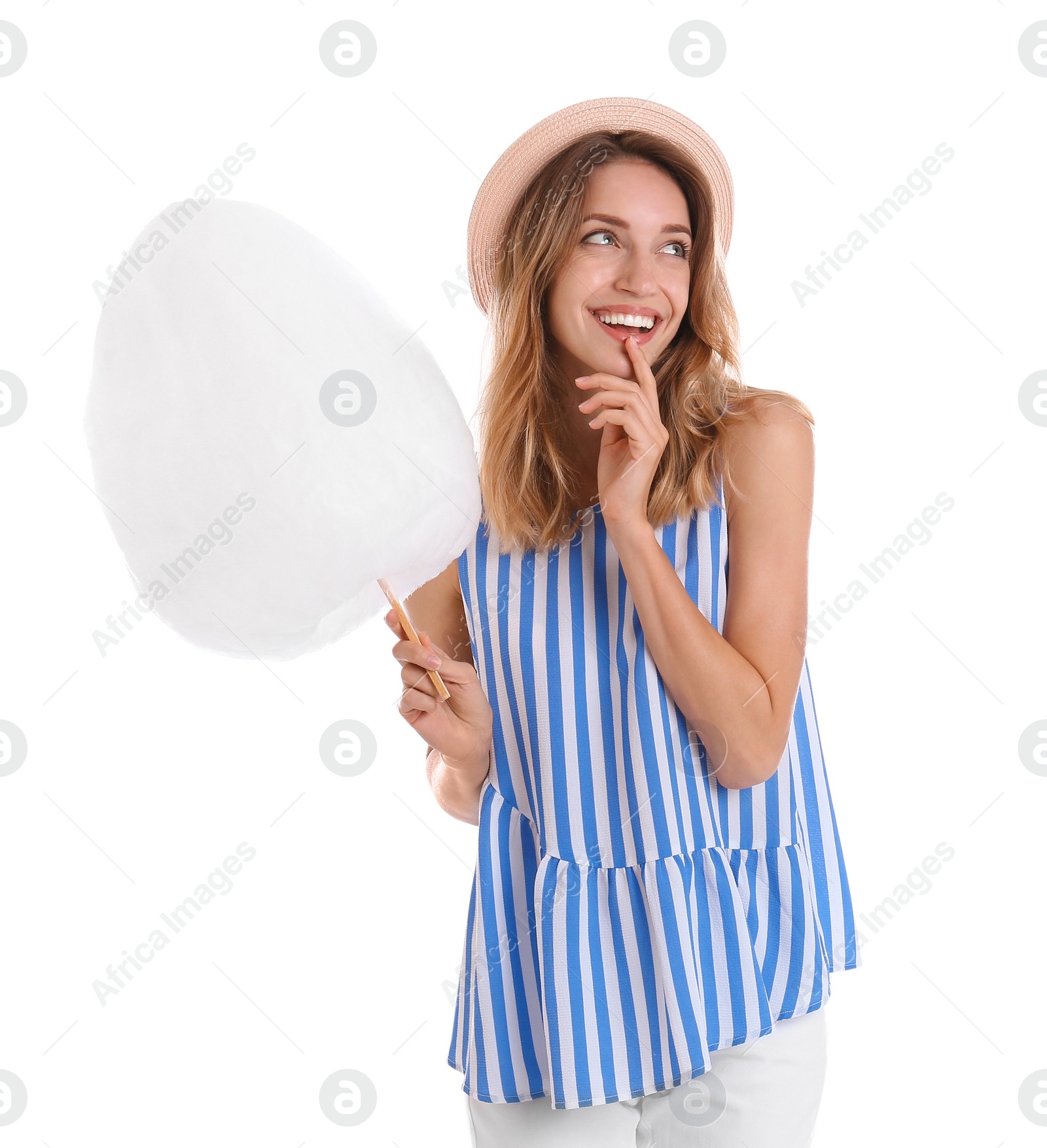 Photo of Happy young woman with cotton candy on white background