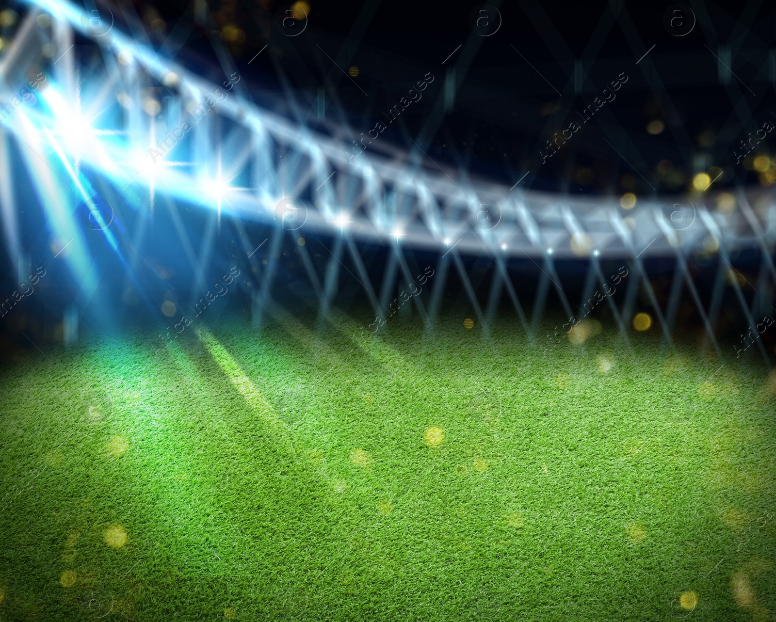 Image of Green sports field under stadium lights, bokeh effect