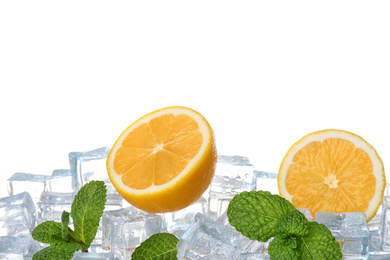 Photo of Ice cubes, mint and lemons on white background