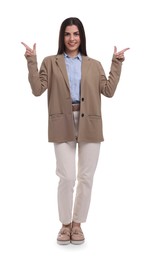 Photo of Beautiful businesswoman pointing at something on white background