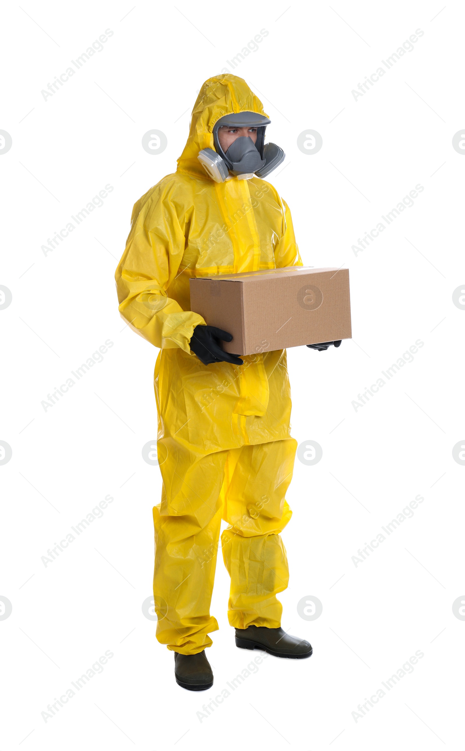 Photo of Man wearing chemical protective suit with cardboard box on white background. Prevention of virus spread