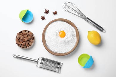 Cooking utensils and ingredients on white background, flat lay