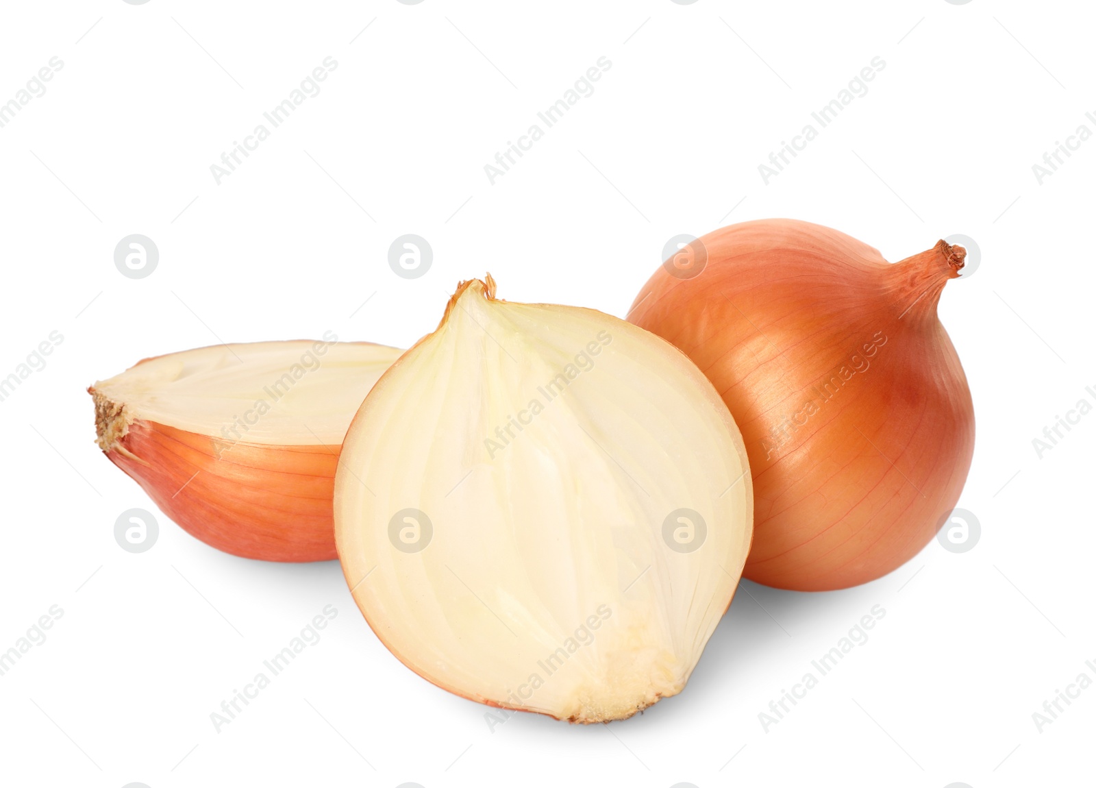 Photo of Whole and cut onions on white background