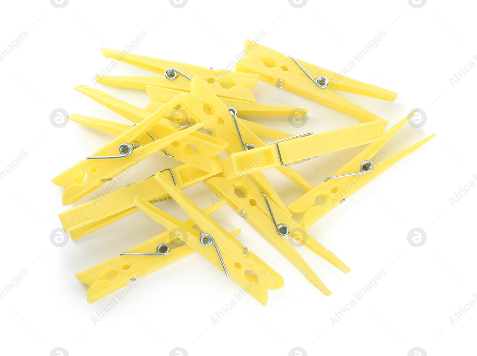 Photo of Yellow plastic clothespins on white background, top view