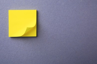 Photo of Blank paper note on color background, top view. Space for text