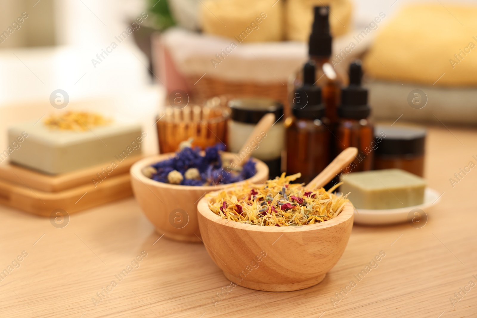 Photo of Dry flowers on wooden table indoors, space for text. Spa time