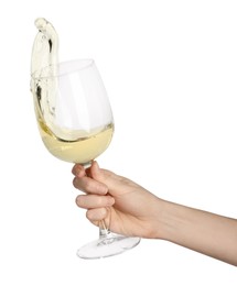 Photo of Woman with tasty aromatic wine splashing out of glass on white background, closeup