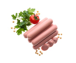 Fresh raw vegetarian sausages, tomato, parsley and soybeans on white background, top view