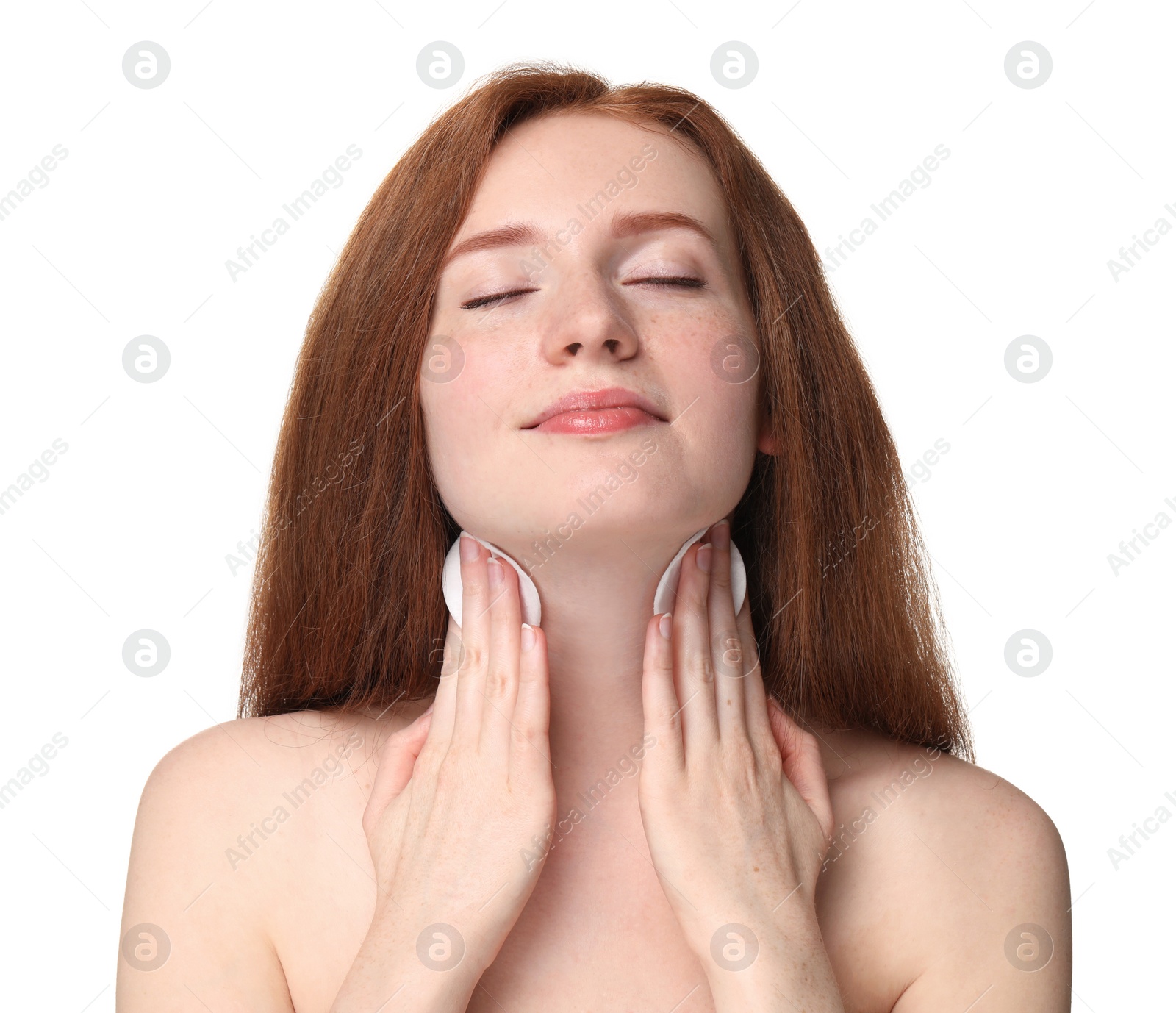 Photo of Beautiful woman with freckles wiping neck on white background