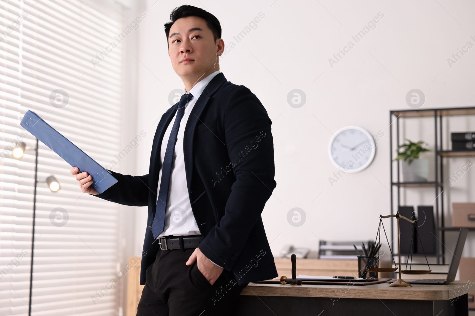 Photo of Portrait of confident notary with clipboard in office