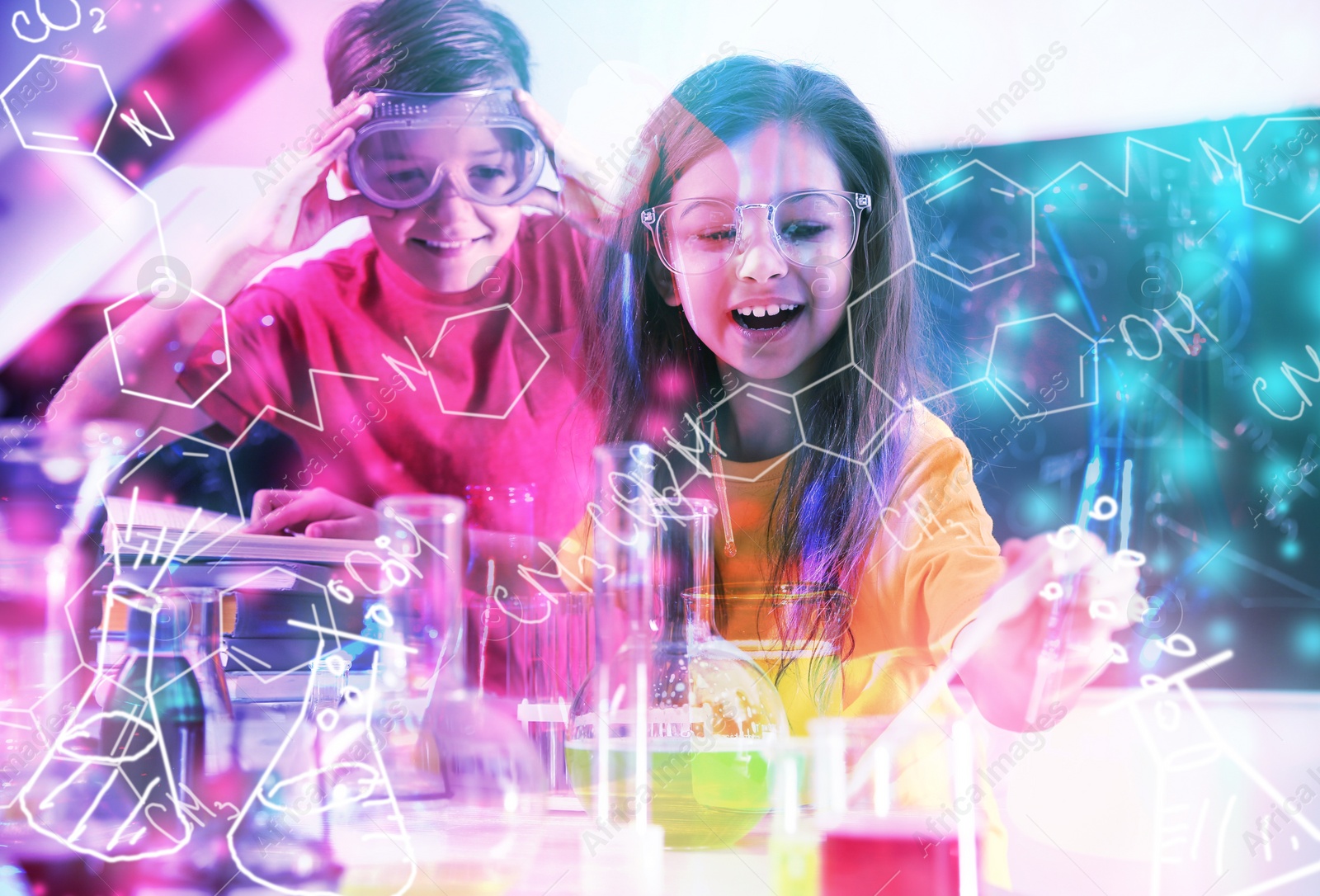 Image of Smart pupils making experiment in chemistry class