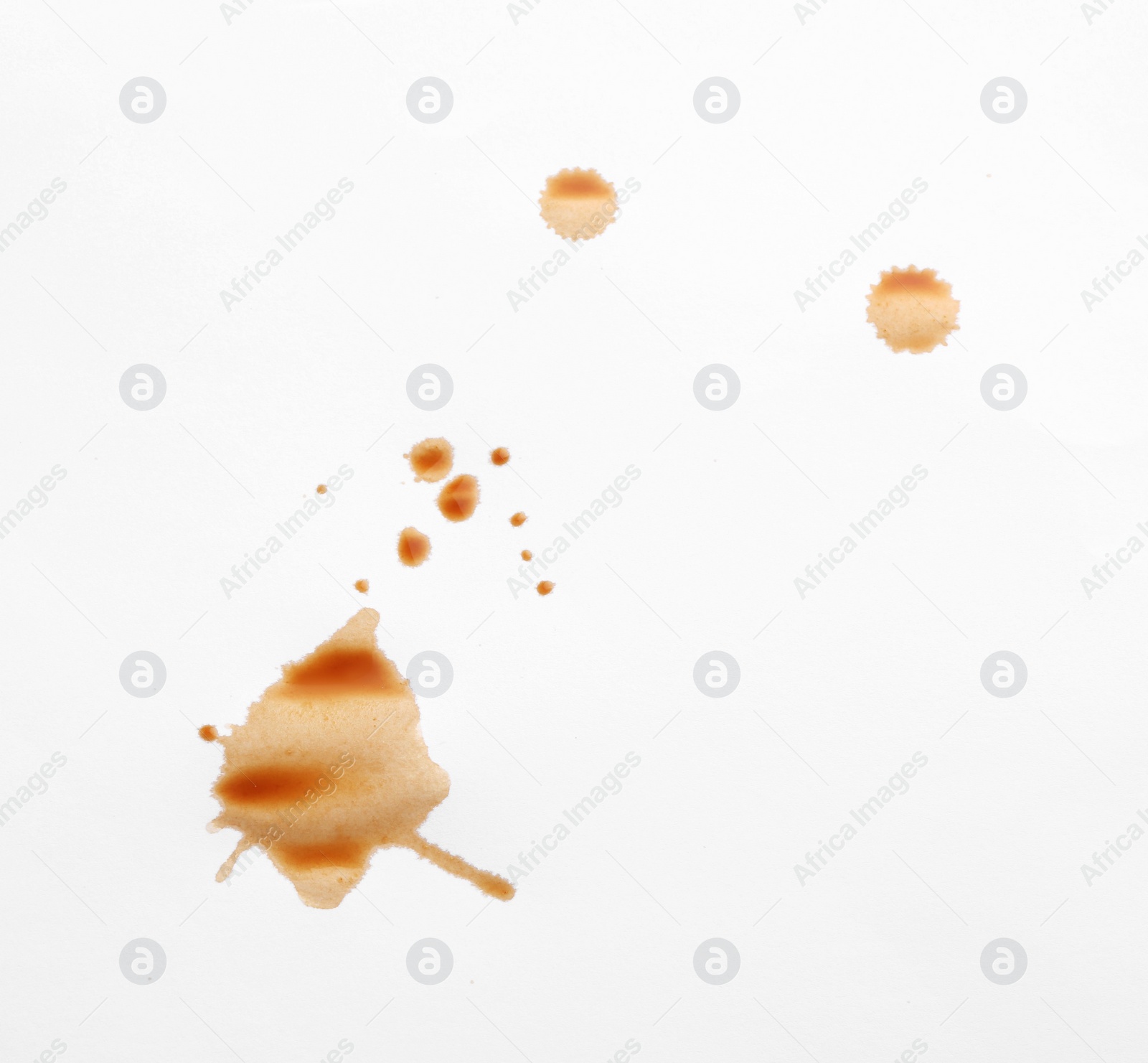 Photo of Dried coffee stains isolated on white, top view