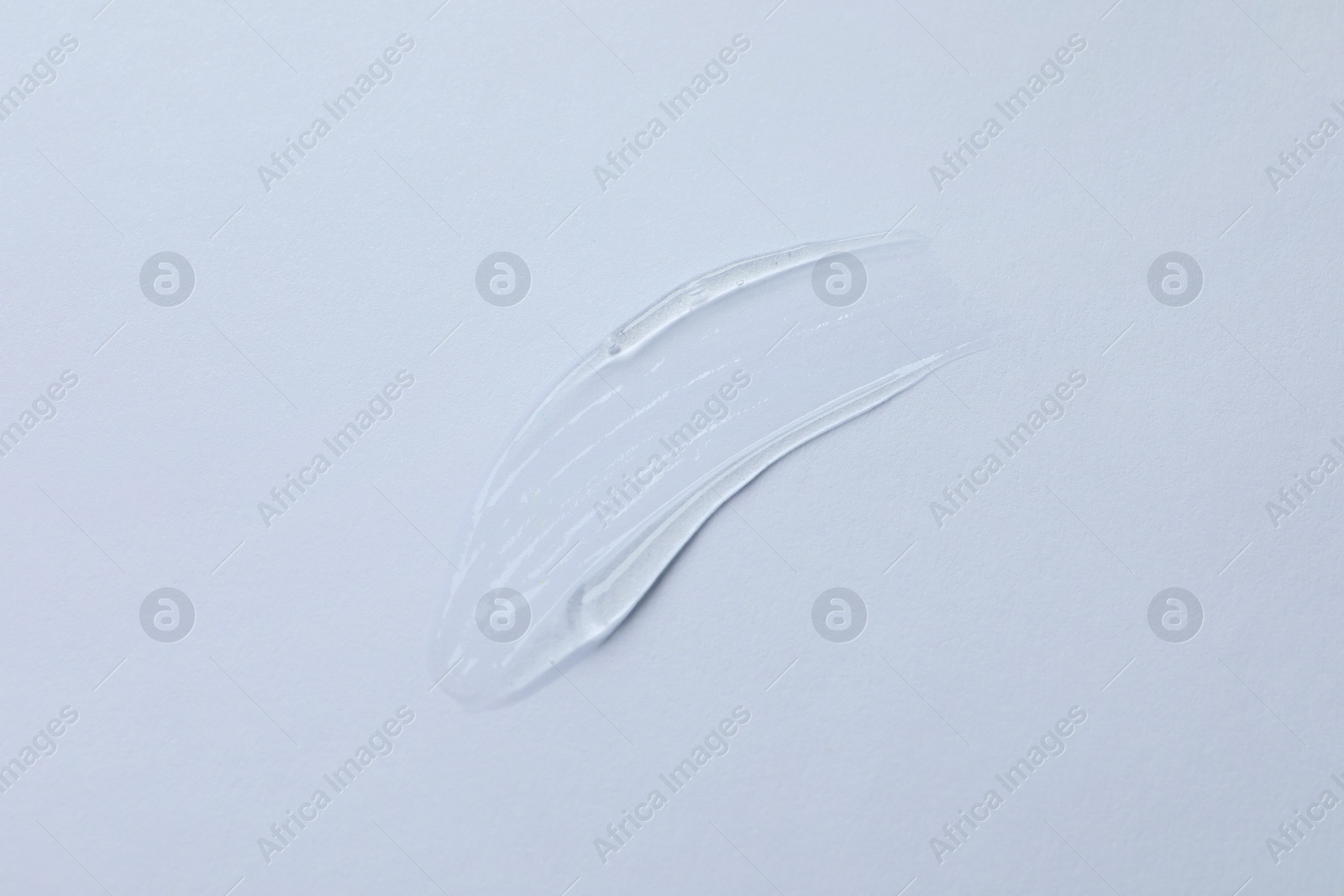 Photo of Swatch of cosmetic gel on white background, top view