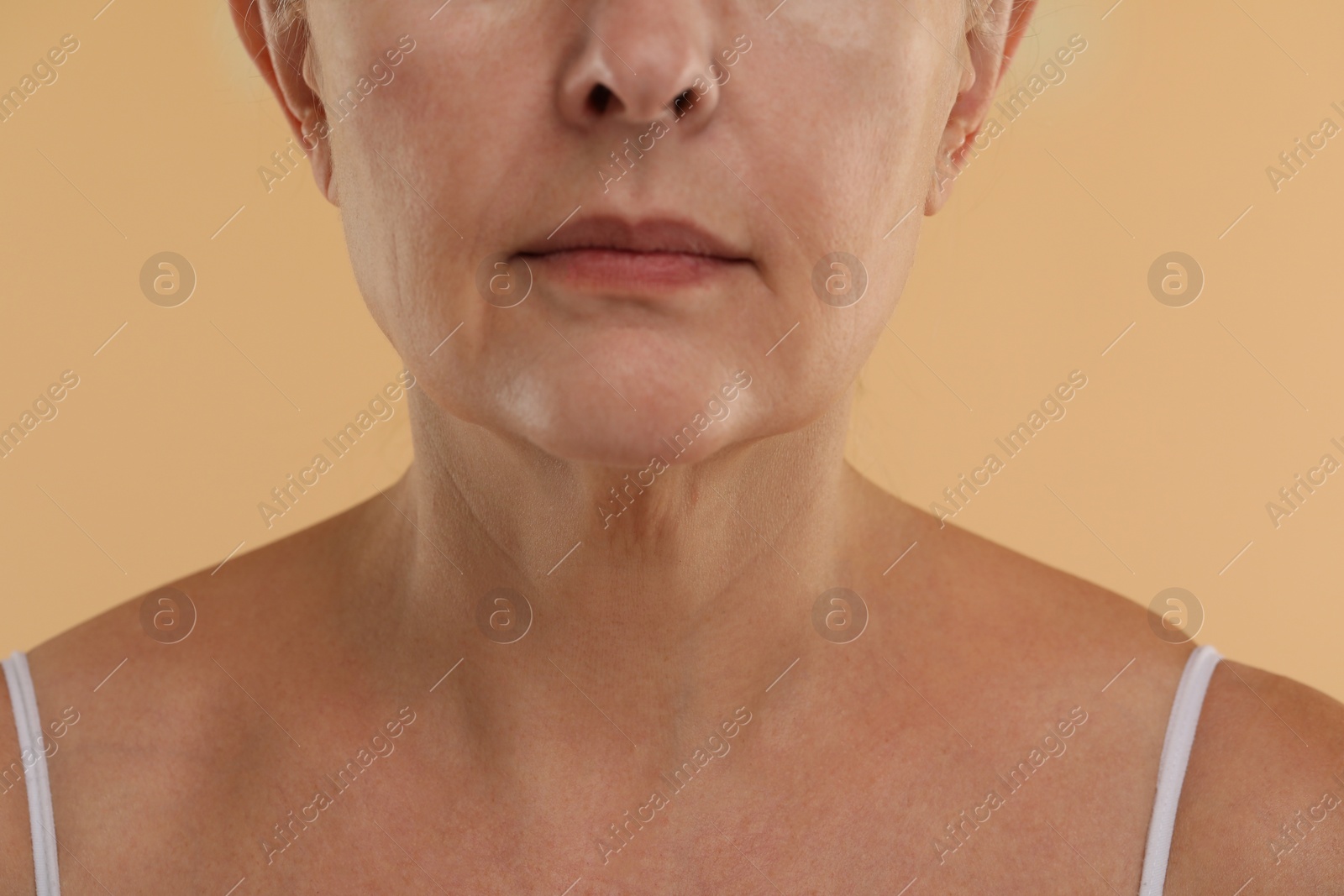 Photo of Woman with normal skin on beige background, macro view