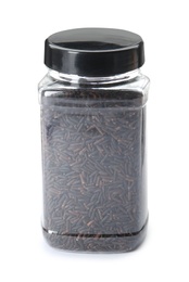 Jar with uncooked black rice on white background