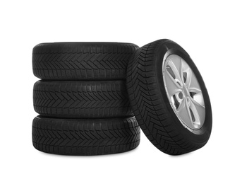 Set of wheels with winter tires on white background