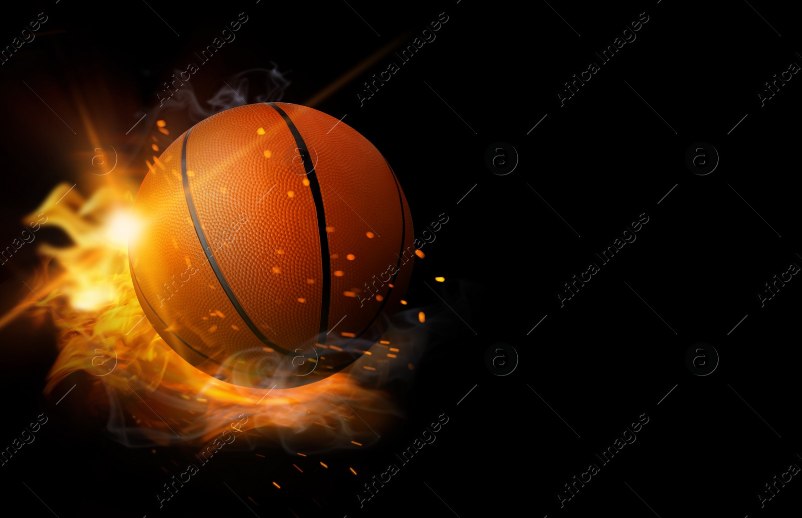 Image of Basketball ball with bright flame on black background, space for text