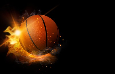 Image of Basketball ball with bright flame on black background, space for text