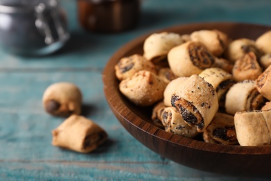 Photo of Tasty sweet cookies with poppy seeds on wooden table. Space for text