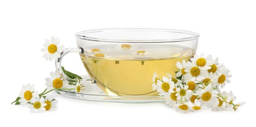 Photo of Aromatic herbal tea in glass cup and chamomiles isolated on white