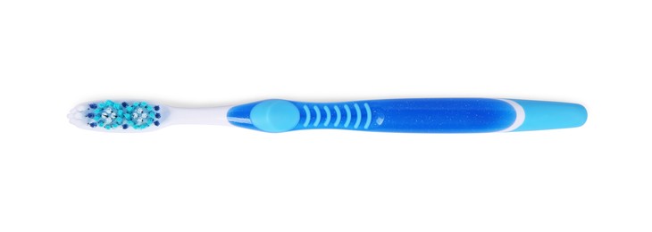 Photo of One blue plastic toothbrush isolated on white, top view