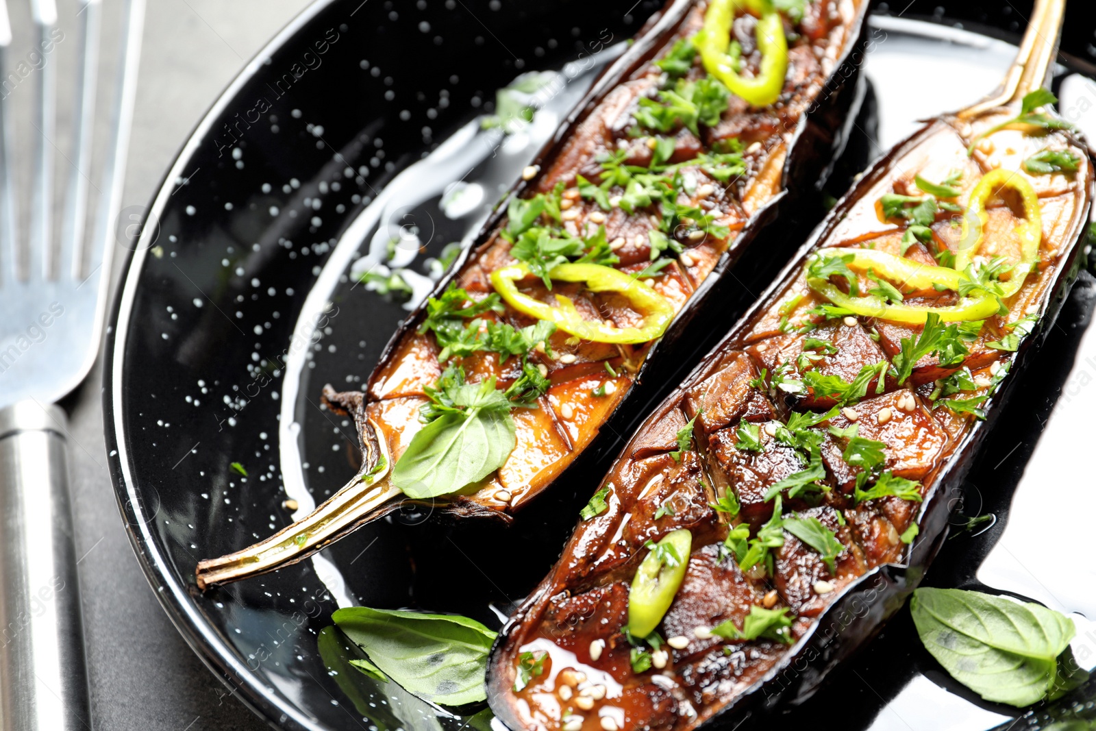 Photo of Frying pan with fried eggplant slices, closeup