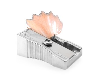 Metal sharpener with pencil shavings on white background