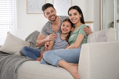 Happy family spending time together at home. Adoption concept