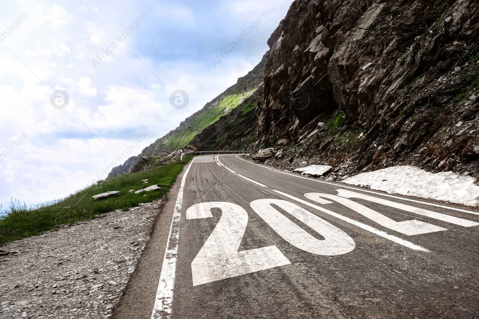 Image of Start new year with fresh vision and ideas. Asphalt road with 2021 numbers in mountains