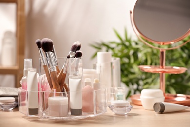 Photo of Set of body care cosmetic products on dressing table. Space for text