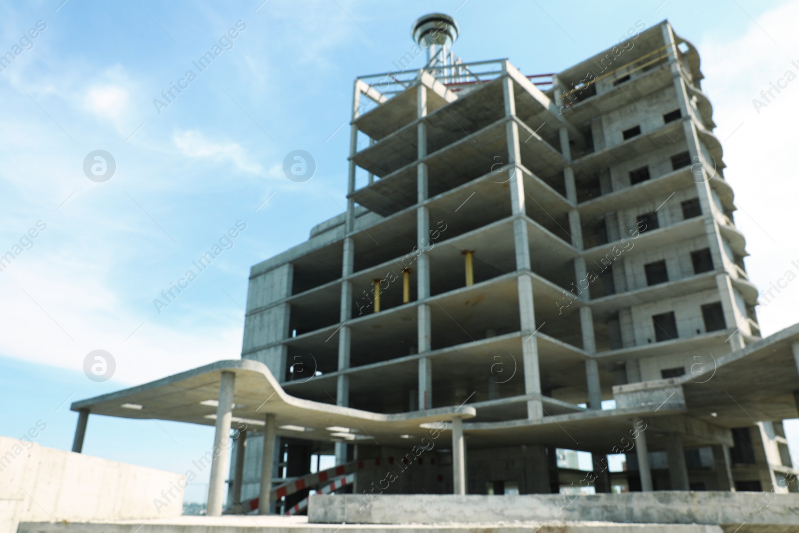 Photo of Blurred view of unfinished building outdoors. Construction safety rules