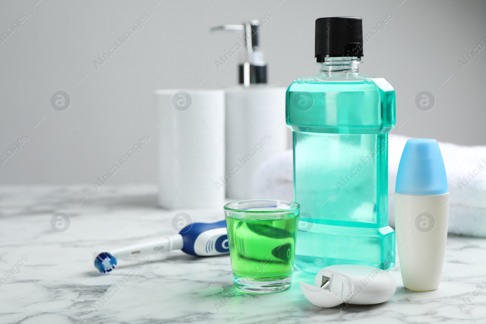 Photo of Set of oral care products on marble table. Teeth hygiene