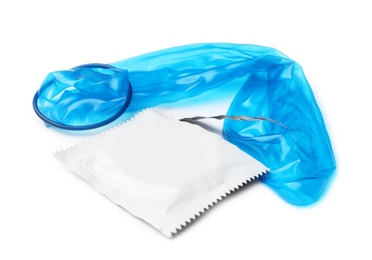 Image of Unrolled blue condom and package on white background. Safe sex