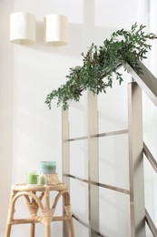 Stylish room decorated with beautiful eucalyptus garland