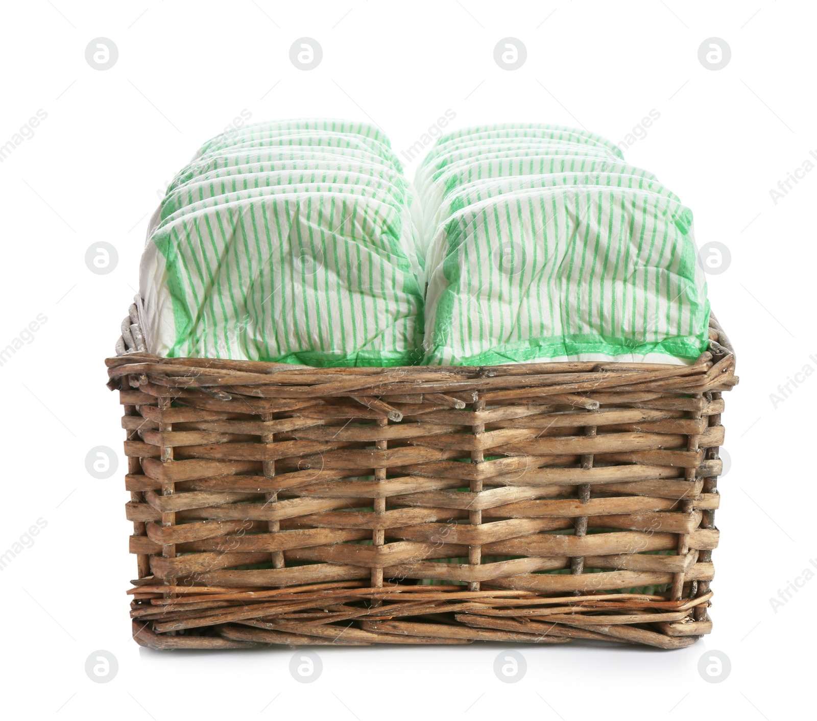 Photo of Basket with diapers on white background. Baby accessories