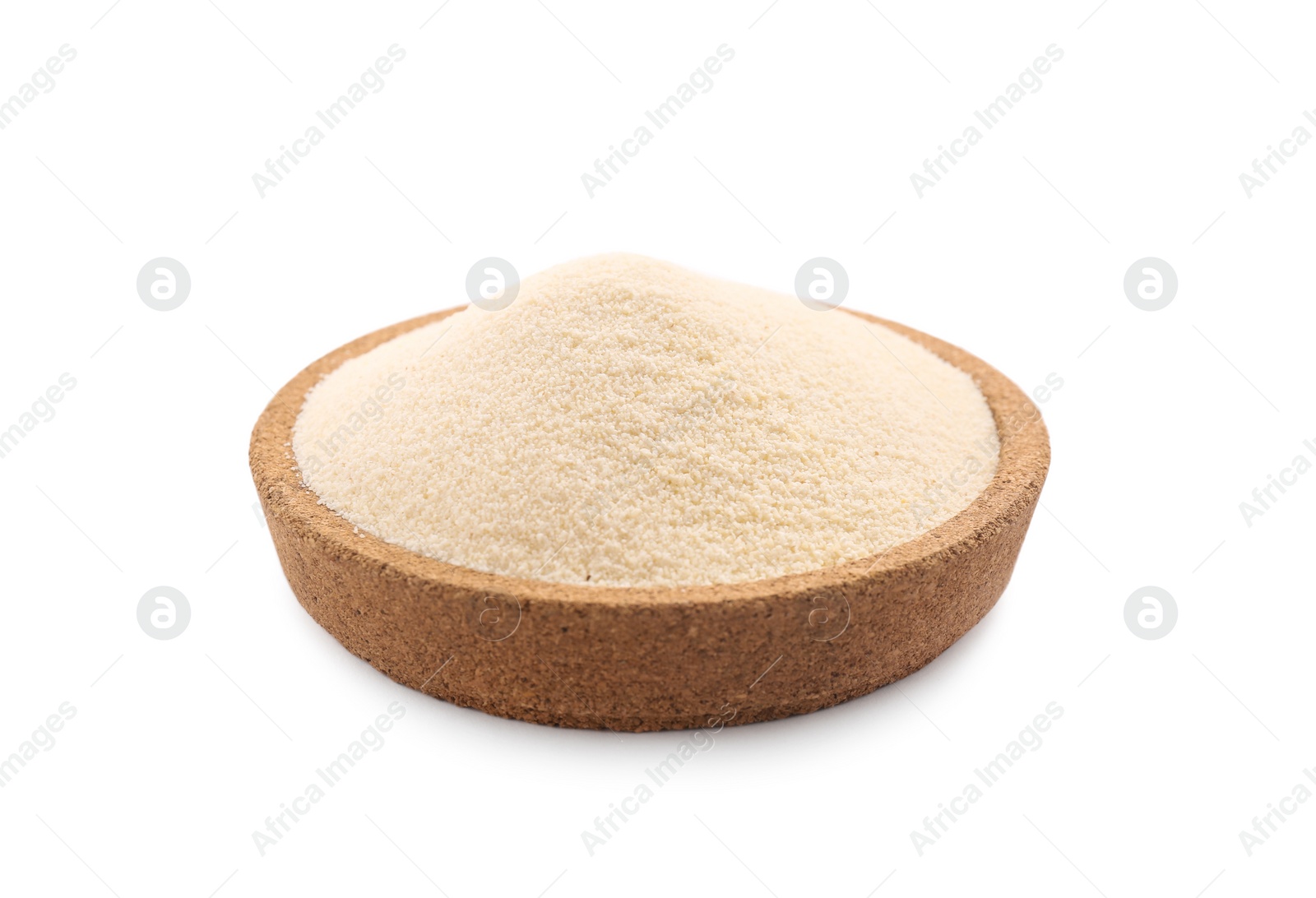 Photo of Uncooked organic semolina in bowl isolated on white