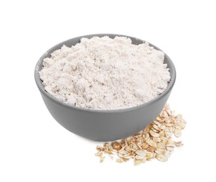 Photo of Bowl with oat flour and flakes on white background