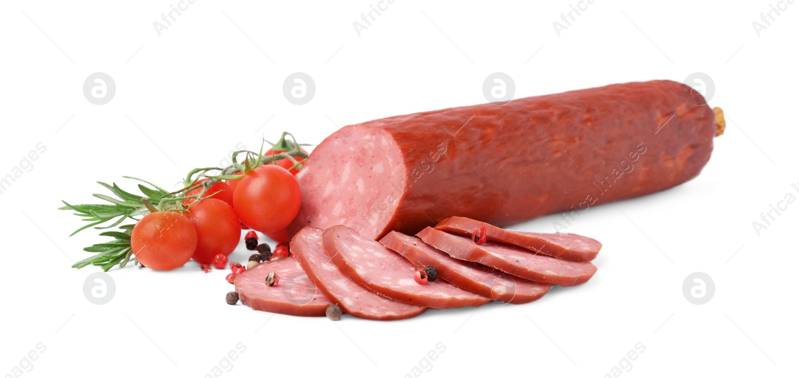 Photo of Delicious cut smoked sausage, tomatoes, rosemary and pepper isolated on white