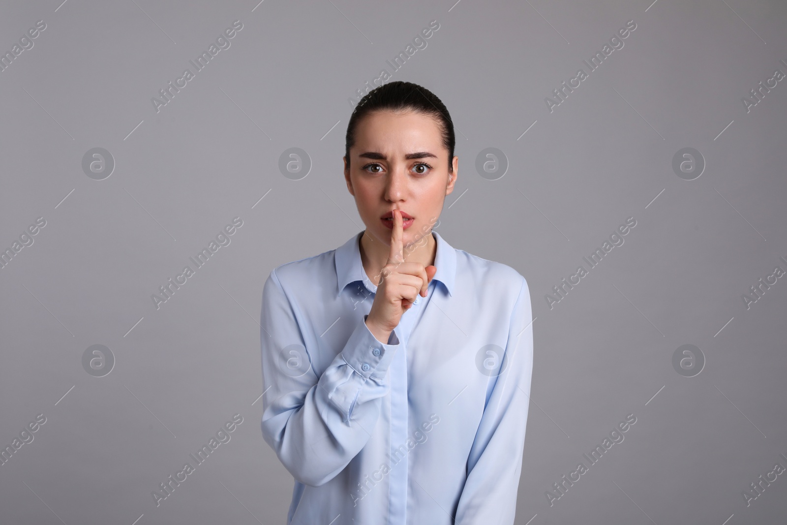 Photo of Portrait of young woman on light grey background. Personality concept