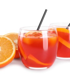 Aperol spritz cocktail, straws and orange slices in glasses isolated on white