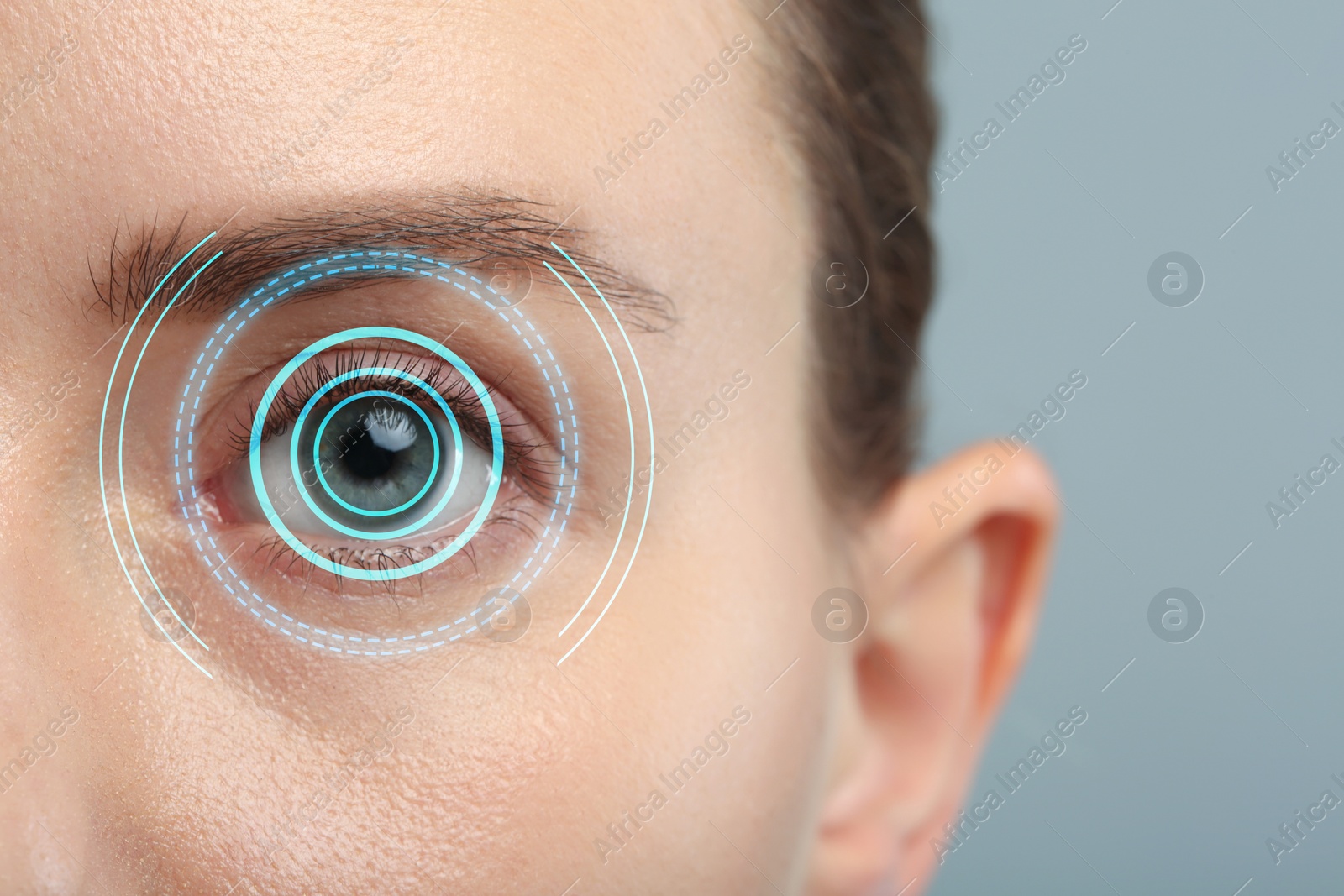 Image of Vision test. Woman and digital scheme focused on her eye against grey background, closeup