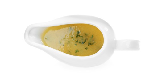 Photo of Ceramic sauce boat with lemon salad dressing on white background, top view