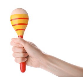 Photo of Woman holding colorful maraca on white background, closeup. Musical instrument