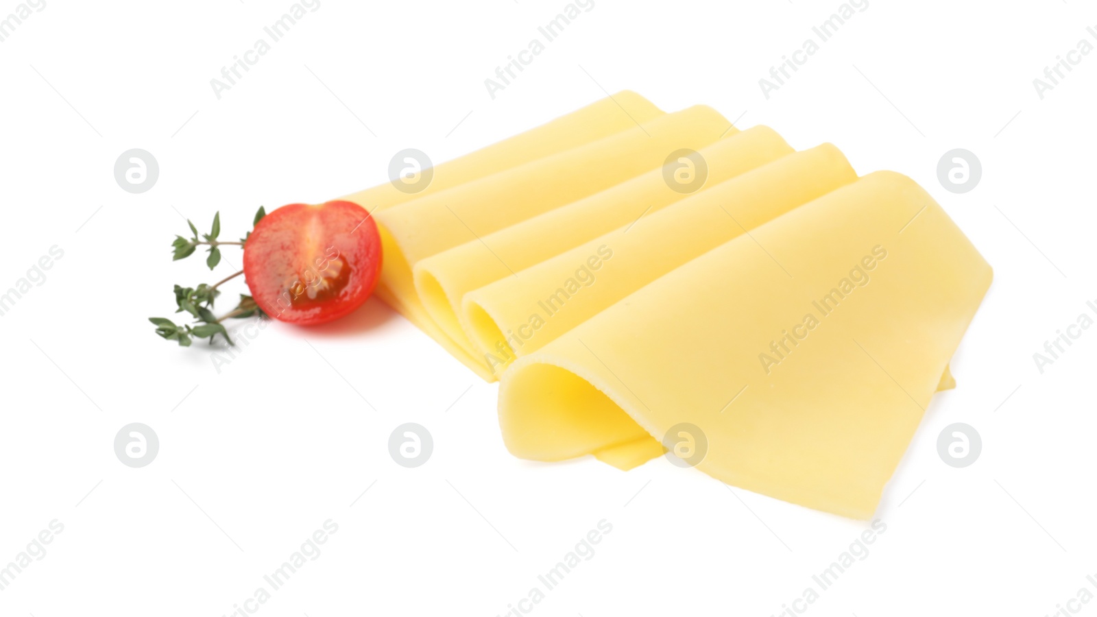 Photo of Slices of tasty fresh cheese, thyme and tomato isolated on white